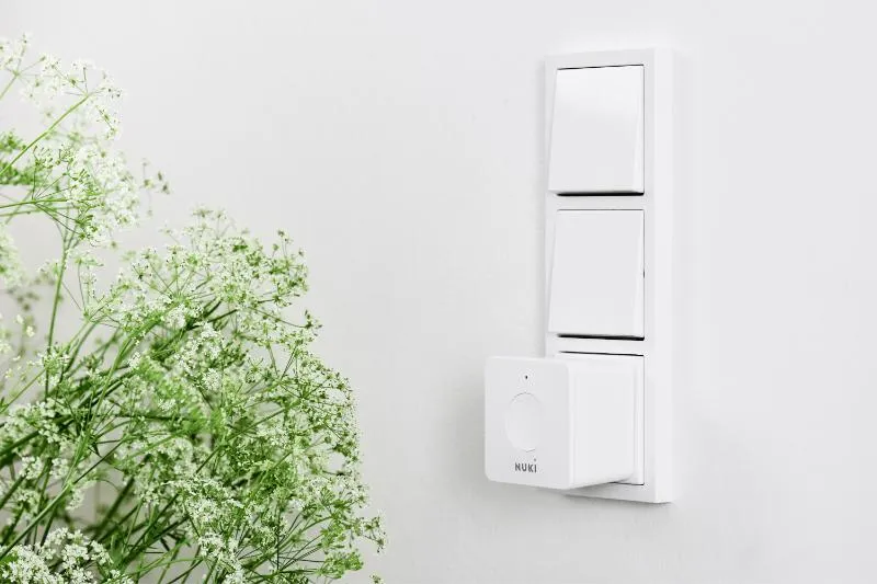 A Nuki Bridge plugged into a socket